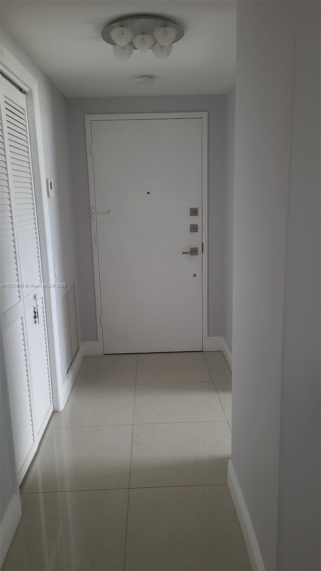 4330 Hillcrest Dr Unit 619, Hollywood, FL 33021 - hallway featuring baseboards and light tile patterned floors
