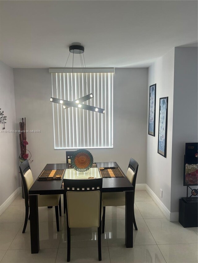 4330 Hillcrest Dr Unit 619, Hollywood, FL 33021 - tiled dining space featuring baseboards
