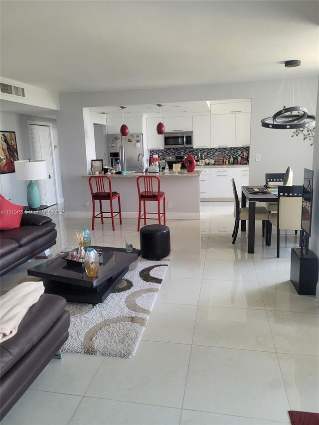 4330 Hillcrest Dr Unit 619, Hollywood, FL 33021 - living area featuring light tile patterned floors