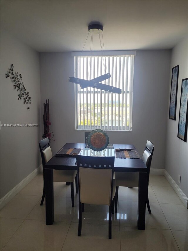4330 Hillcrest Dr Unit 619, Hollywood, FL 33021 - tiled dining room featuring baseboards