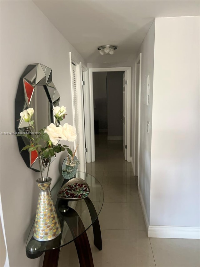 4330 Hillcrest Dr Unit 619, Hollywood, FL 33021 - hallway featuring baseboards and light tile patterned floors
