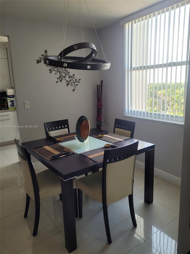 4330 Hillcrest Dr Unit 619, Hollywood, FL 33021 - dining area with baseboards and light tile patterned flooring