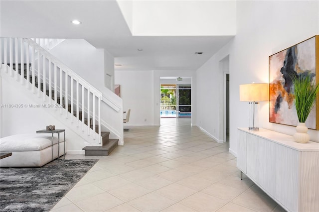 1906 Timberline Rd, Weston, FL 33327 - entrance foyer with light tile patterned floors, stairway, baseboards, recessed lighting, and a high ceiling