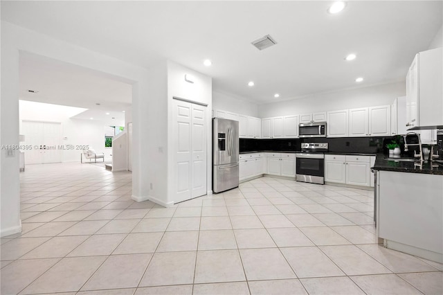 1906 Timberline Rd, Weston, FL 33327 - kitchen with appliances with stainless steel finishes, a sink, dark countertops, light tile patterned floors, and recessed lighting