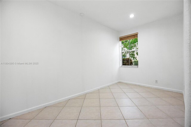 1906 Timberline Rd, Weston, FL 33327 - spare room featuring recessed lighting, light tile patterned floors, baseboards, and vaulted ceiling