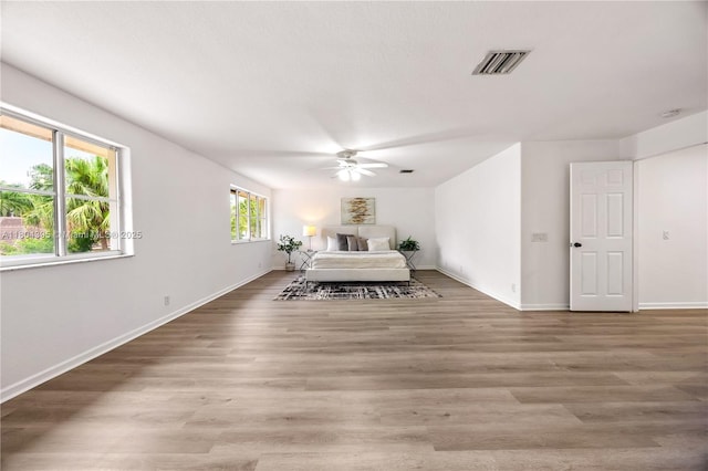 1906 Timberline Rd, Weston, FL 33327 - bedroom with baseboards, wood finished floors, and a ceiling fan
