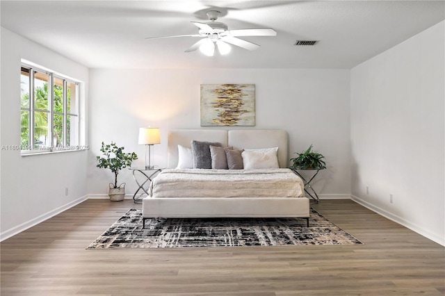 1906 Timberline Rd, Weston, FL 33327 - bedroom with wood finished floors, baseboards, and a ceiling fan