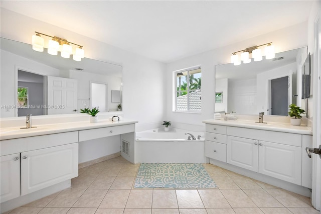 1906 Timberline Rd, Weston, FL 33327 - full bath featuring two vanities, a bath, plenty of natural light, and tile patterned flooring