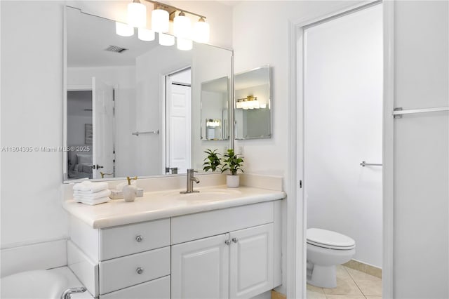 1906 Timberline Rd, Weston, FL 33327 - bathroom with vanity, toilet, and tile patterned flooring