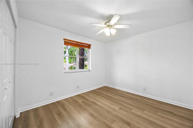 1906 Timberline Rd, Weston, FL 33327 - unfurnished bedroom with wood finished floors, baseboards, a closet, and a ceiling fan