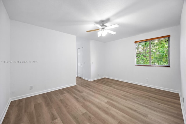 1906 Timberline Rd, Weston, FL 33327 - unfurnished room with wood finished floors, baseboards, and ceiling fan