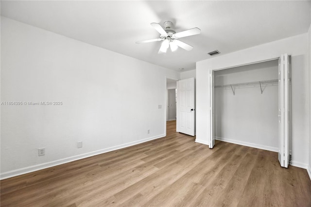 1906 Timberline Rd, Weston, FL 33327 - unfurnished bedroom featuring wood finished floors, baseboards, a closet, and ceiling fan