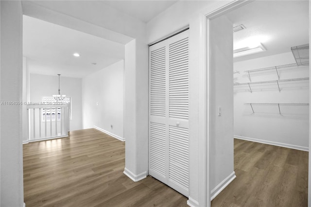 1906 Timberline Rd, Weston, FL 33327 - hall with wood finished floors, a chandelier, baseboards, and recessed lighting