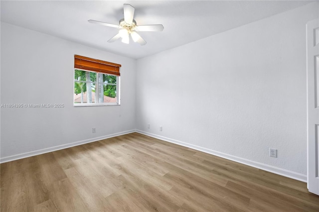 1906 Timberline Rd, Weston, FL 33327 - unfurnished room with wood finished floors, a ceiling fan, and baseboards