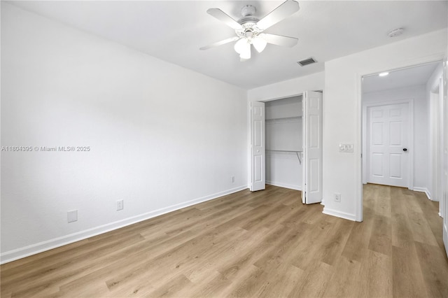 1906 Timberline Rd, Weston, FL 33327 - unfurnished bedroom featuring light wood-style floors, a closet, baseboards, and a ceiling fan