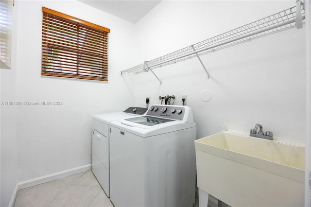 1906 Timberline Rd, Weston, FL 33327 - laundry area with washer and dryer, baseboards, and light tile patterned floors