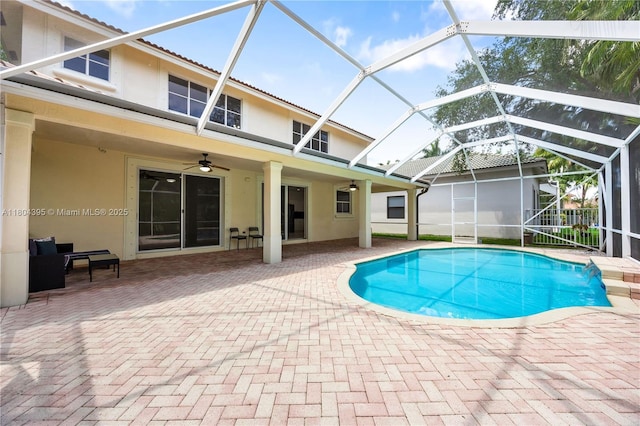 1906 Timberline Rd, Weston, FL 33327 - outdoor pool featuring ceiling fan, a patio area, and glass enclosure