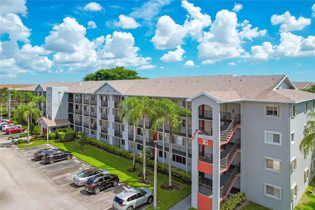 801 SW 138th Ave Unit 404E, Pembroke Pines, FL 33027 - view of building exterior featuring uncovered parking