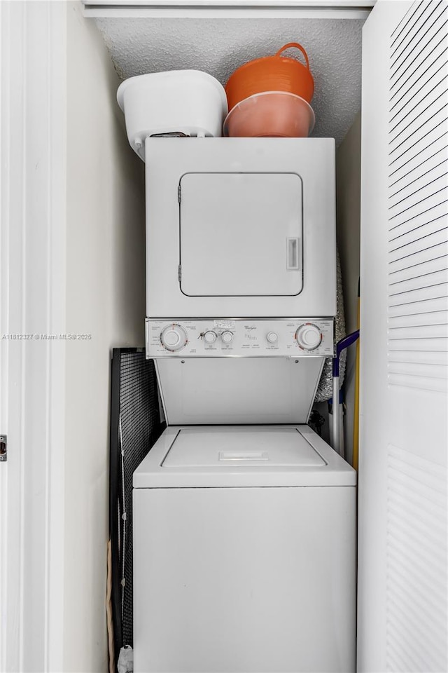801 SW 138th Ave Unit 404E, Pembroke Pines, FL 33027 - washroom with stacked washer and clothes dryer