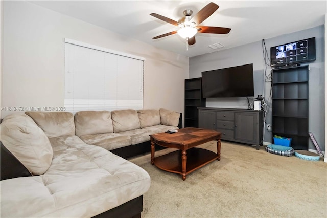 1070 Swiss Pointe Ln, Rockledge, FL 32955 - living room featuring ceiling fan and carpet flooring