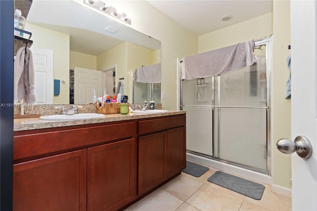 1070 Swiss Pointe Ln, Rockledge, FL 32955 - full bathroom with tile patterned floors, a shower stall, and double vanity