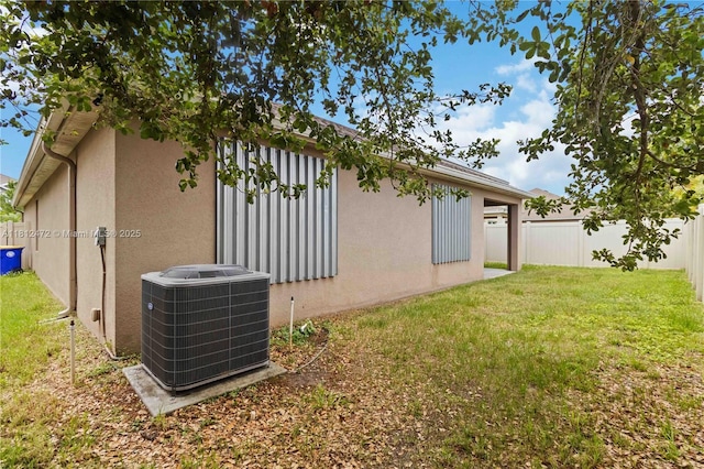 1070 Swiss Pointe Ln, Rockledge, FL 32955 - view of home's exterior featuring central AC and stucco siding