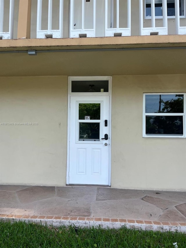 620 NE 12th Ave Unit 107, Hallandale Beach, FL 33009 - view of exterior entry featuring stucco siding