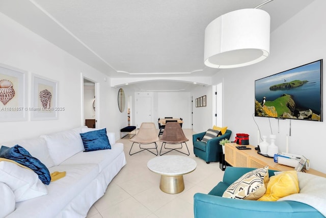 5701 Collins Ave Unit 712, Miami Beach, FL 33140 - living room featuring arched walkways and tile patterned flooring