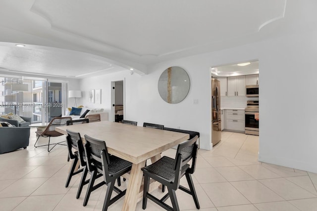 5701 Collins Ave Unit 712, Miami Beach, FL 33140 - dining area with light tile patterned floors and recessed lighting