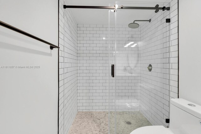 5701 Collins Ave Unit 712, Miami Beach, FL 33140 - full bathroom featuring a stall shower and toilet
