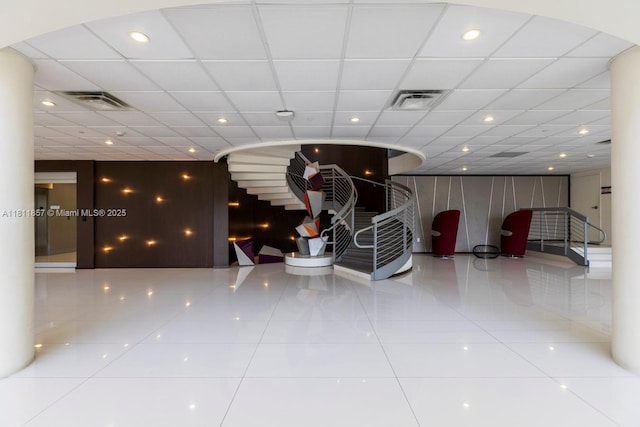 5701 Collins Ave Unit 712, Miami Beach, FL 33140 - building lobby featuring a paneled ceiling and recessed lighting