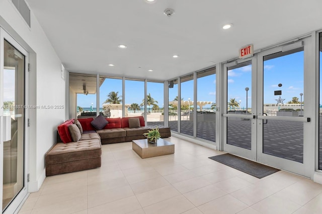 5701 Collins Ave Unit 712, Miami Beach, FL 33140 - sunroom / solarium featuring french doors, healthy amount of natural light, recessed lighting, floor to ceiling windows, and tile patterned flooring