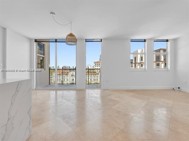 4100 Salzedo St Unit 901, Coral Gables, FL 33146 - empty room with baseboards and light tile patterned flooring