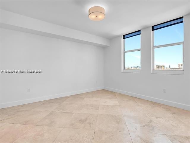 4100 Salzedo St Unit 901, Coral Gables, FL 33146 - spare room with baseboards