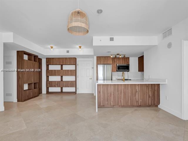 4100 Salzedo St Unit 901, Coral Gables, FL 33146 - kitchen with stainless steel appliances, a peninsula, light countertops, a sink, and open floor plan