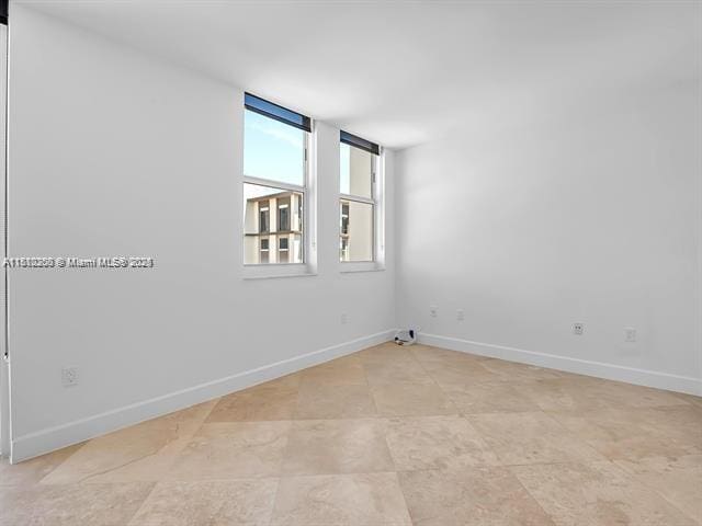 4100 Salzedo St Unit 901, Coral Gables, FL 33146 - spare room featuring baseboards