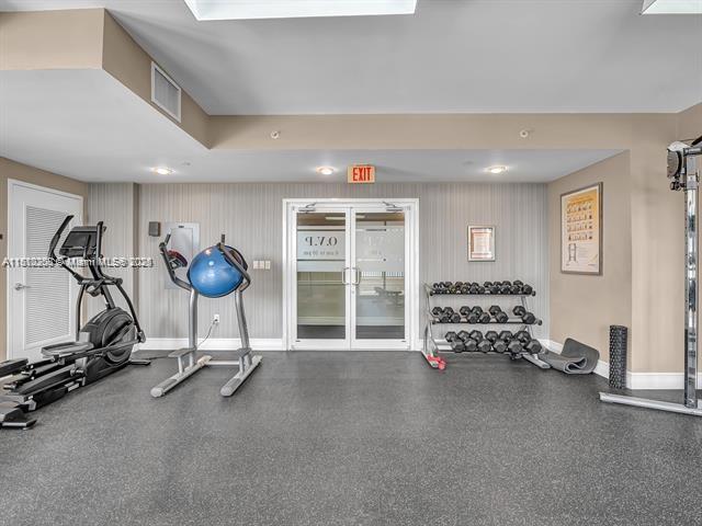 4100 Salzedo St Unit 901, Coral Gables, FL 33146 - workout area featuring baseboards