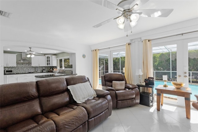 10421 NW 21st St, Pembroke Pines, FL 33026 - living area featuring french doors, a ceiling fan, healthy amount of natural light, and light tile patterned floors