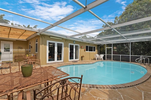 10421 NW 21st St, Pembroke Pines, FL 33026 - swimming pool featuring french doors, a patio, and a lanai
