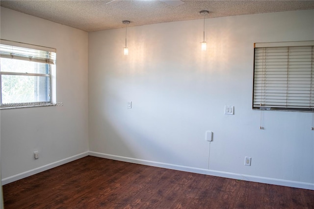 3090 Holiday Springs Blvd Unit 305, Margate, FL 33063 - spare room featuring wood finished floors, baseboards, and a textured ceiling