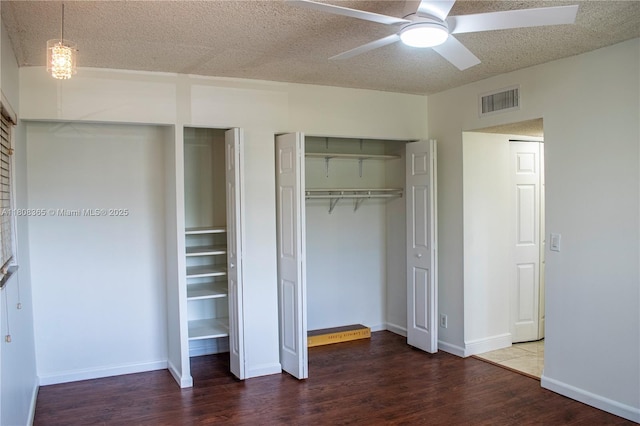 3090 Holiday Springs Blvd Unit 305, Margate, FL 33063 - unfurnished bedroom featuring wood finished floors, baseboards, a textured ceiling, and ceiling fan
