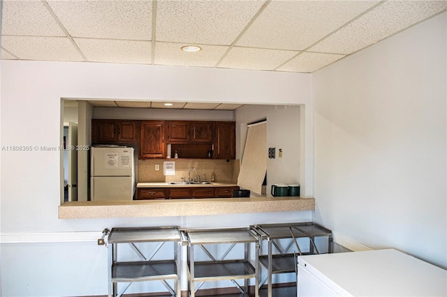 3090 Holiday Springs Blvd Unit 305, Margate, FL 33063 - kitchen featuring freestanding refrigerator, a sink, a drop ceiling, light countertops, and refrigerator