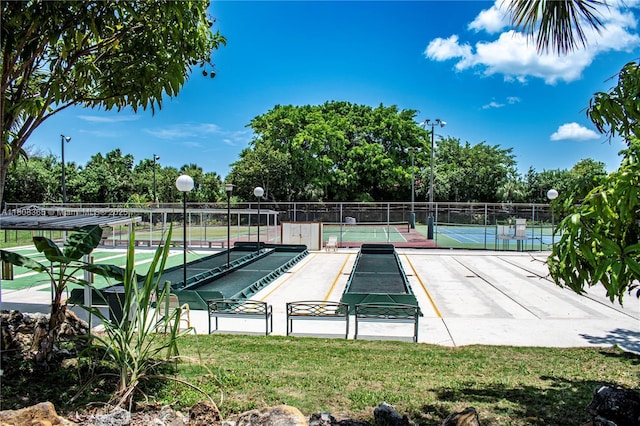 3090 Holiday Springs Blvd Unit 305, Margate, FL 33063 - surrounding community with a bocce ball area, a tennis court, and view of scattered trees