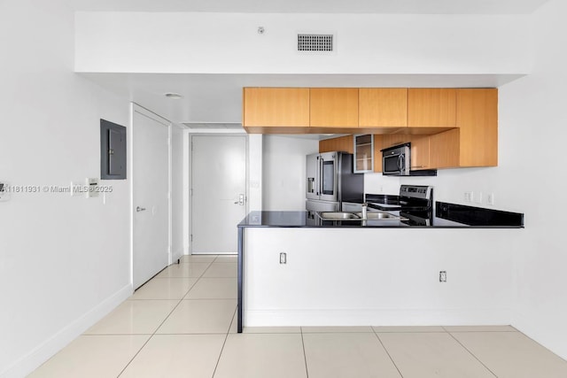 1750 N Bayshore Dr Unit 4801, Miami, FL 33132 - kitchen featuring stainless steel appliances, a peninsula, dark countertops, electric panel, and light tile patterned flooring