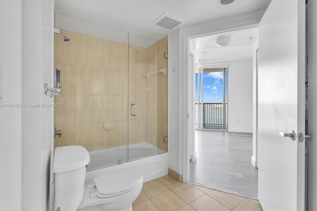 1750 N Bayshore Dr Unit 4801, Miami, FL 33132 - bathroom with tile patterned floors, toilet, shower / bath combination with glass door, and baseboards