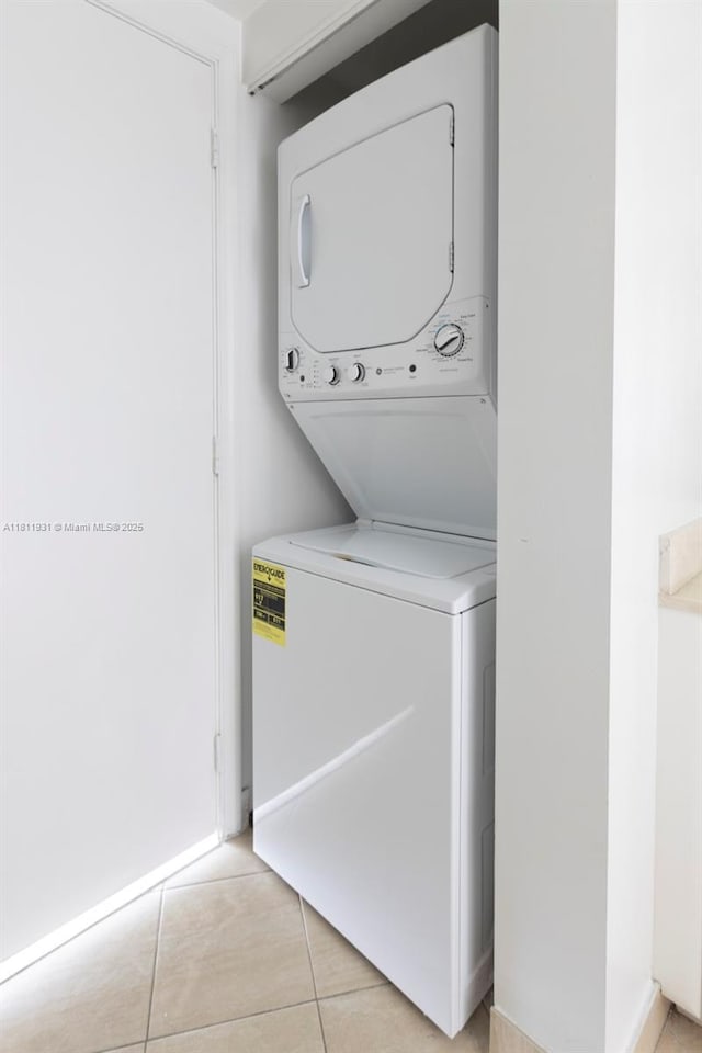 1750 N Bayshore Dr Unit 4801, Miami, FL 33132 - laundry room featuring estacked washer and dryer and light tile patterned flooring