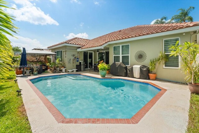 18342 NW 11th St, Pembroke Pines, FL 33029 - swimming pool with a gazebo, a patio area, and grilling area