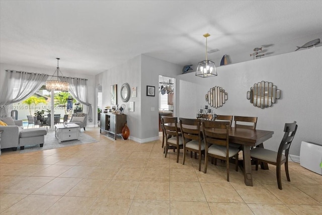 18342 NW 11th St, Pembroke Pines, FL 33029 - dining room with a chandelier, light tile patterned floors, and baseboards