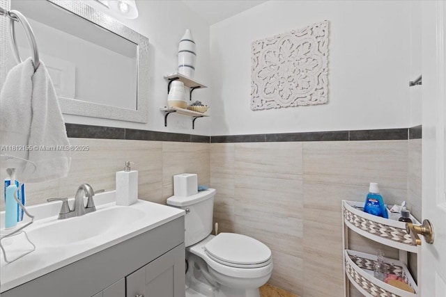 18342 NW 11th St, Pembroke Pines, FL 33029 - bathroom featuring tile walls, vanity, toilet, and wainscoting