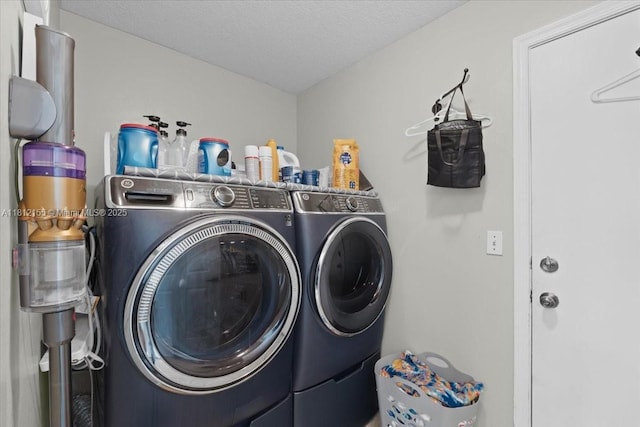 18342 NW 11th St, Pembroke Pines, FL 33029 - laundry area with washing machine and clothes dryer and a textured ceiling